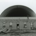 Donald Judd inspects the recently installed pre - fabricated metal panel roof on the South Artillery Shed, 1984. Image Courtesy of Chinati Foundation Archives Donald Judd’s Artillery Sheds in Texas to Undergo Major Restoration - Image 2 of 12
