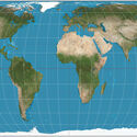 The world on Eckert IV projection. 15° graticule. Imagery is a derivative of NASA’s Blue Marble summer month composite with oceans lightened to enhance legibility and contrast. Image created with the Geocart map projection software.. Image © Strebe via Wikimedia Commons UN General Assembly Votes to Promote Equal Earth Projection for More Accurate World Maps - Image 3 of 8